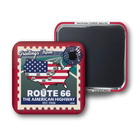 Two square Route 66 themed magnets shown on a white background, with one front-facing and one back-facing. The front magnet features a red border, a postage-stamp style design, a map of the United States with the American flag, and the text 'Greetings From ROUTE 66 THE AMERICAN HIGHWAY EST.
