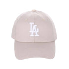 Beige cap with white logo on a white background