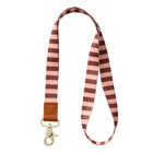 Striped lanyard with a brown leather strap and gold clasp on a white background