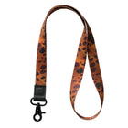 Leopard print lanyard with a black clip on a white background