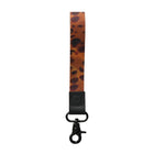 Leopard print lanyard with black clip on a white background