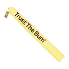 Yellow inflatable tube with 'Trust The Bum' text on a white background